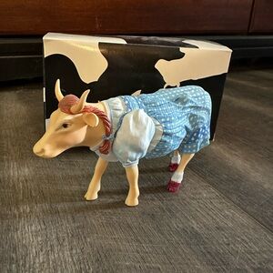 Cow Parade Wizard of Oz figurines. Collection includes 9 figures.